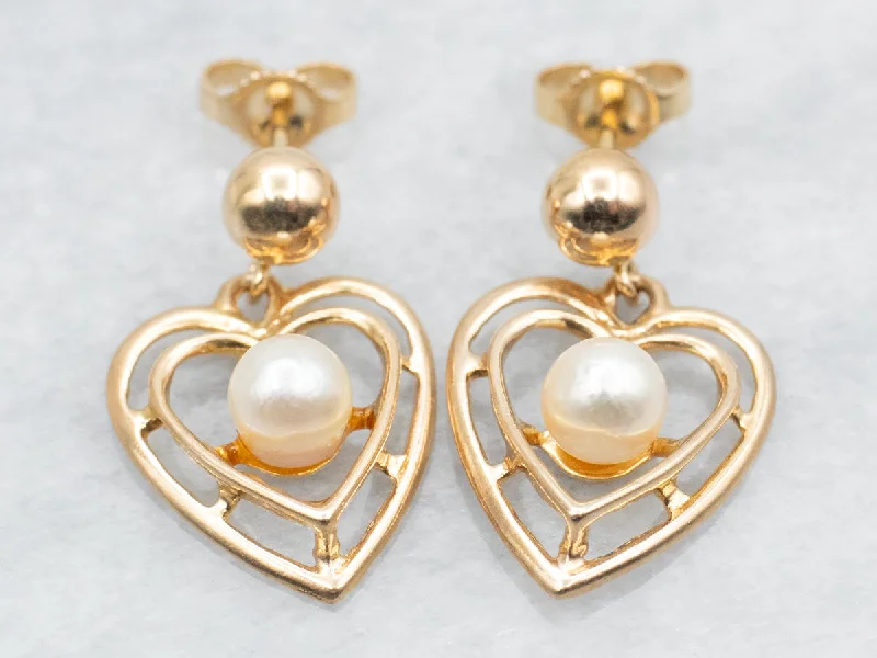 Subtle moonstone drop earrings for soft lunar elegance -Polished Gold Heart and Pearl Drop Earrings